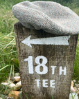 Flat Cap in Herringbone Harris Tweed® on 18th Tee Post